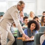 teacher-assisting-student-during-lecture-id490357692-180409.jpg